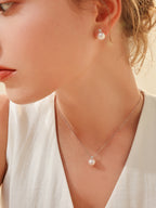 Princess Diana-style 18K gold Akoya saltwater pearl stud earrings (set with natural diamonds)